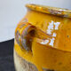 Old yellow glazed terracotta grease pot south west France