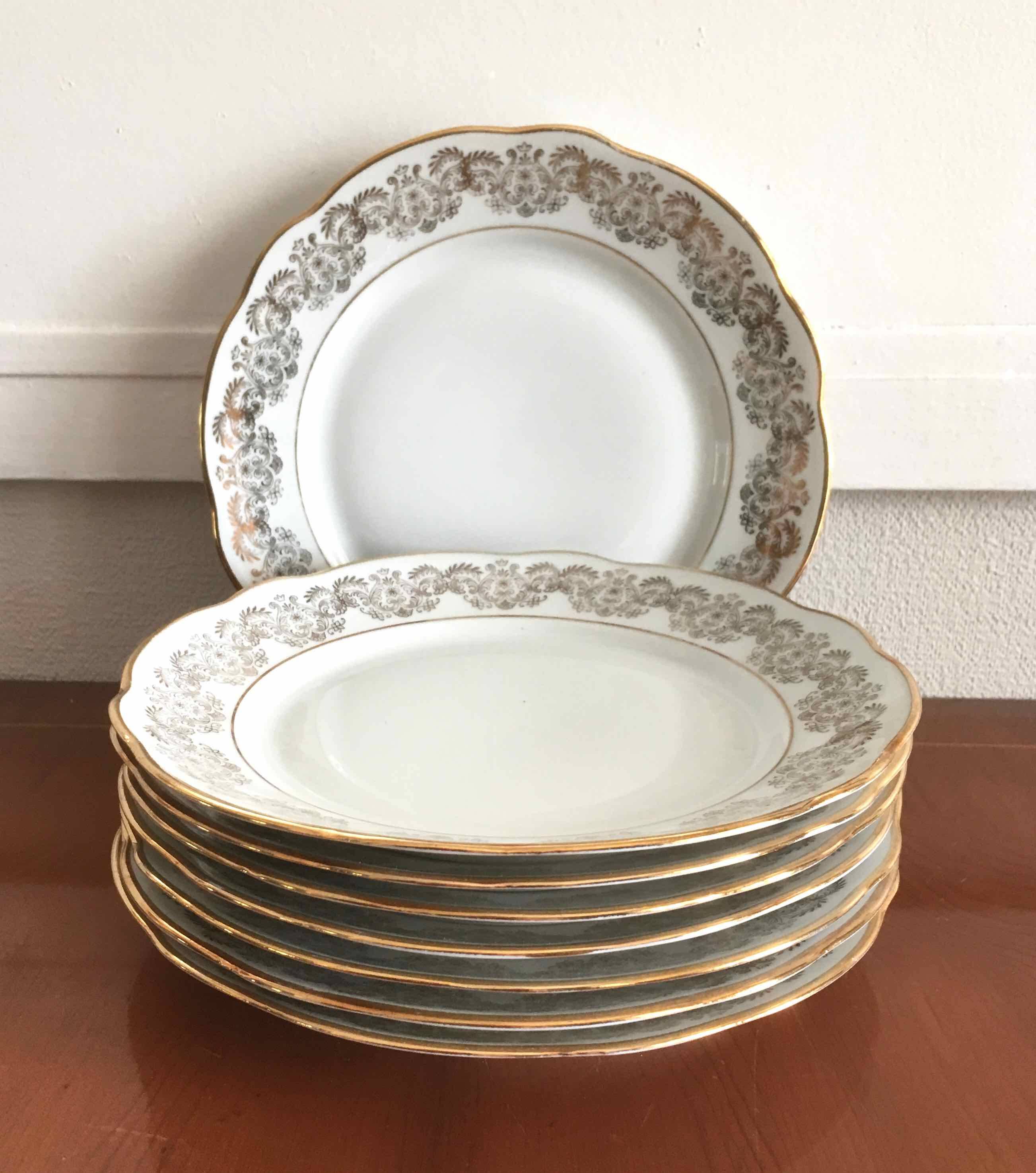 8 white and gold porcelain dessert plates