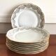 8 white and gold porcelain dessert plates
