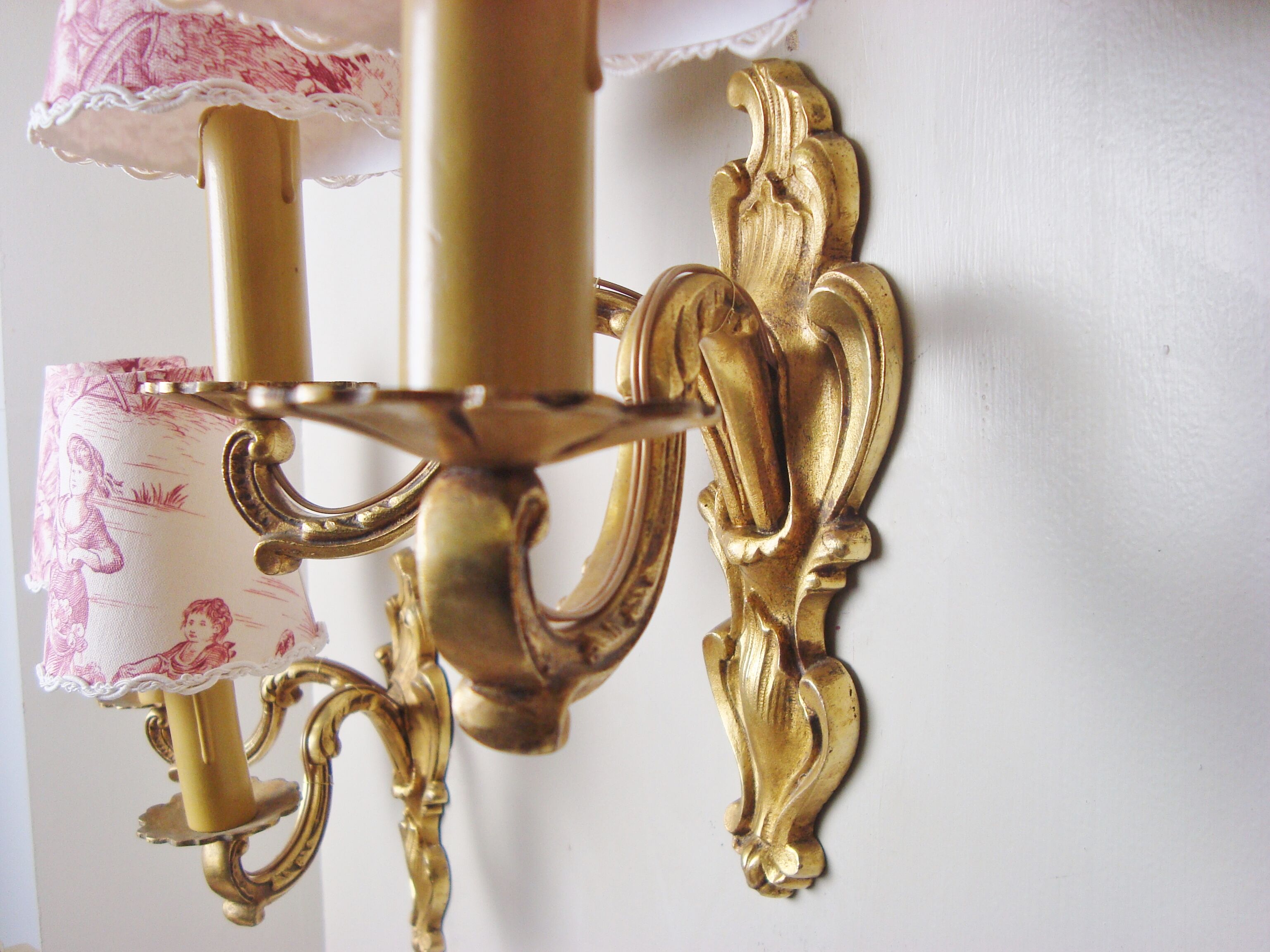 Pair of bronze sconces with four handmade toile de Jouy lampshades in France