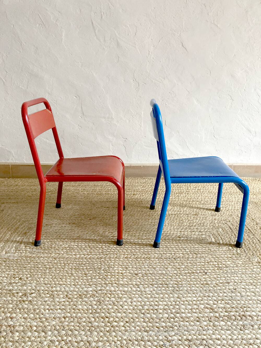 Pair of Mullca nursery chairs in metal and wood painted red and blue