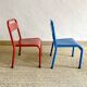 Pair of Mullca nursery chairs in metal and wood painted red and blue