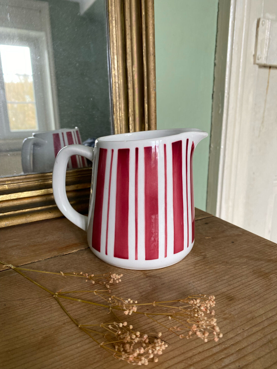 Old striped milk jug