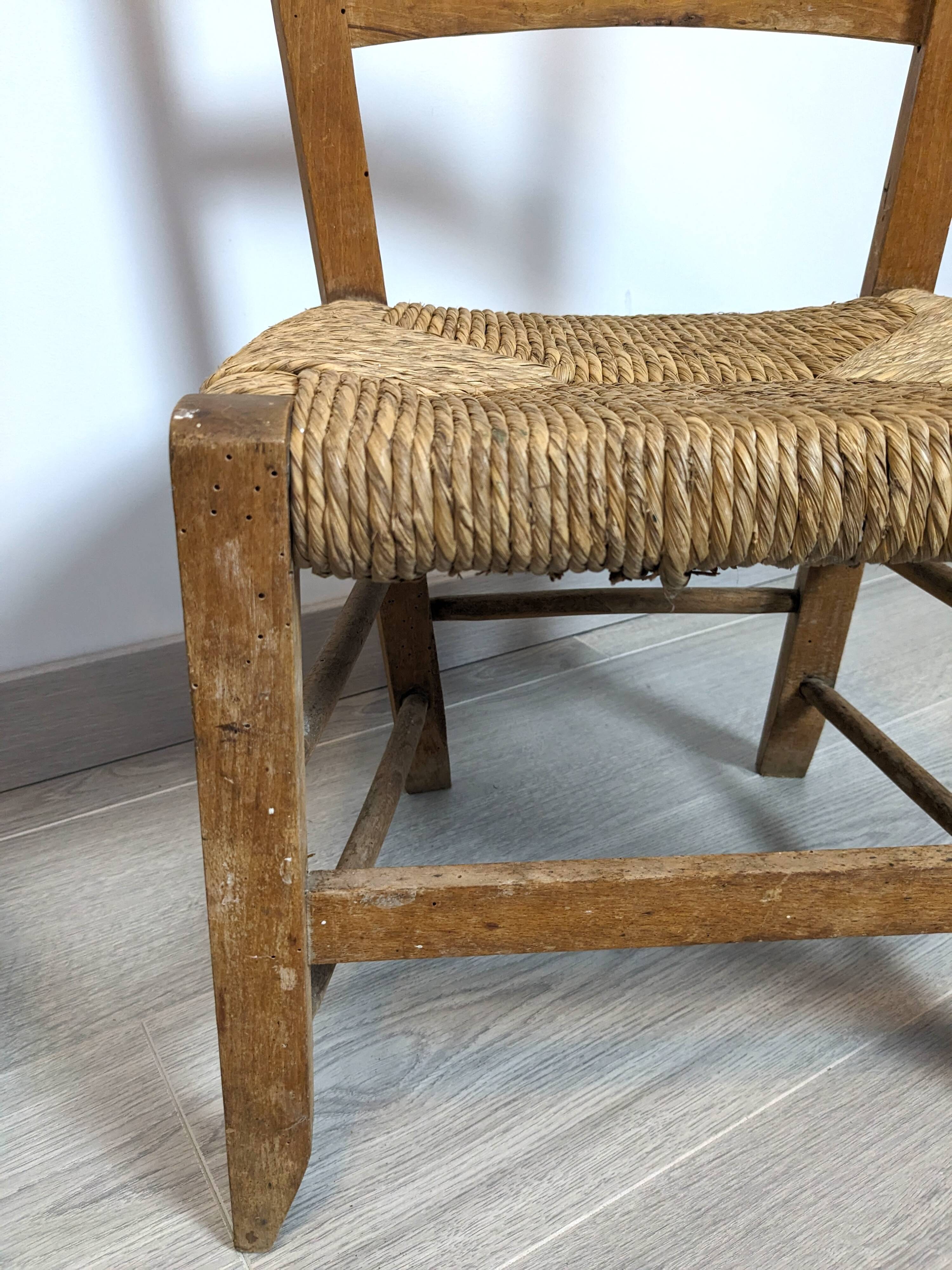 Vintage wooden and straw children's chair in a country style.