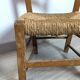 Vintage wooden and straw children's chair in a country style.