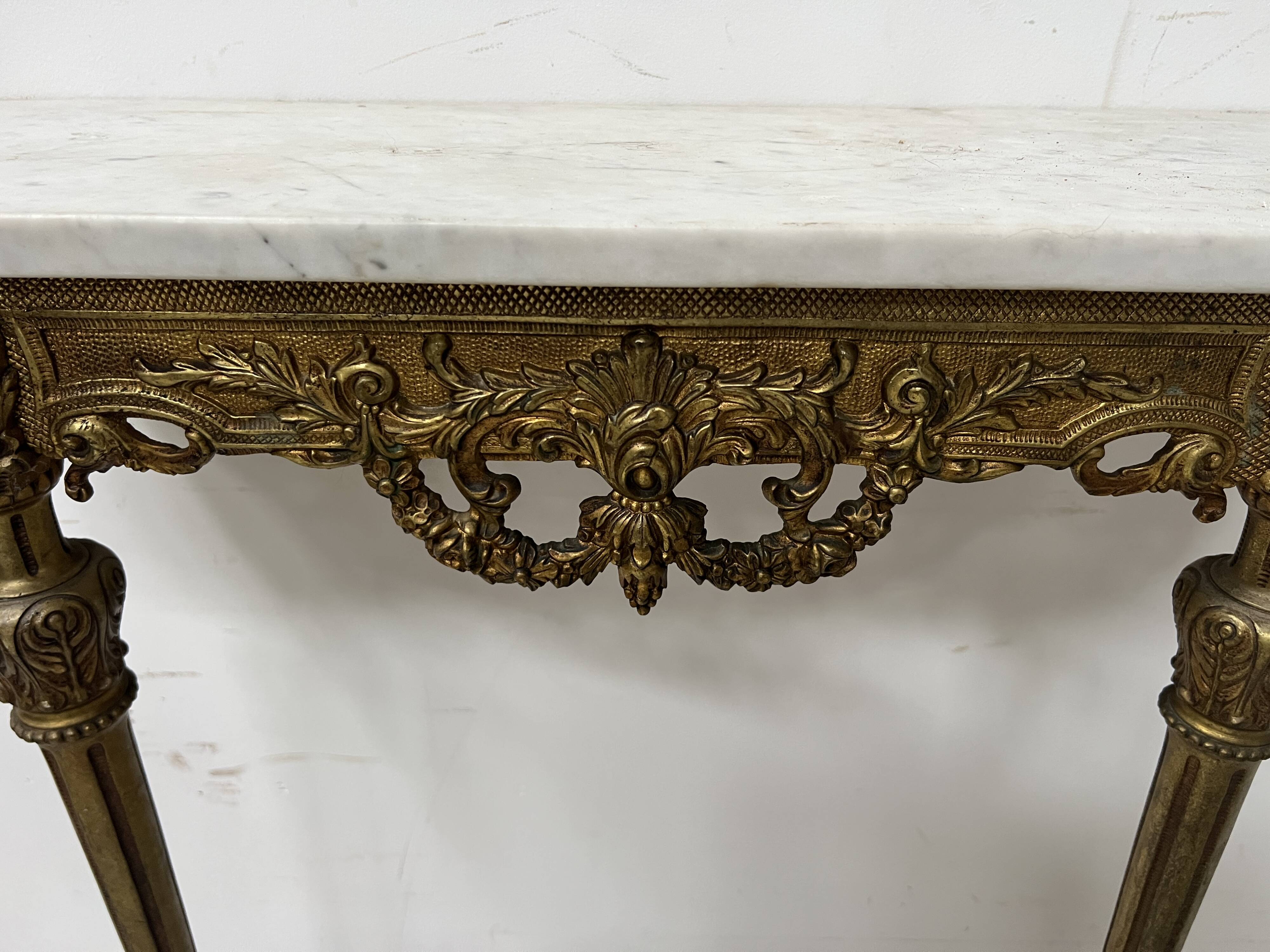 Louis XVI style console in chiselled bronze, 20th century.