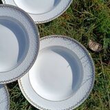 Twelve white porcelain plates