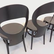 Set of 4 vintage Mouette chairs by Baumann in black wood from the 1960s.