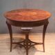 Round pedestal table in veneer wood