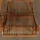 Vintage wicker armchair with magazine rack, Italy, 1960s