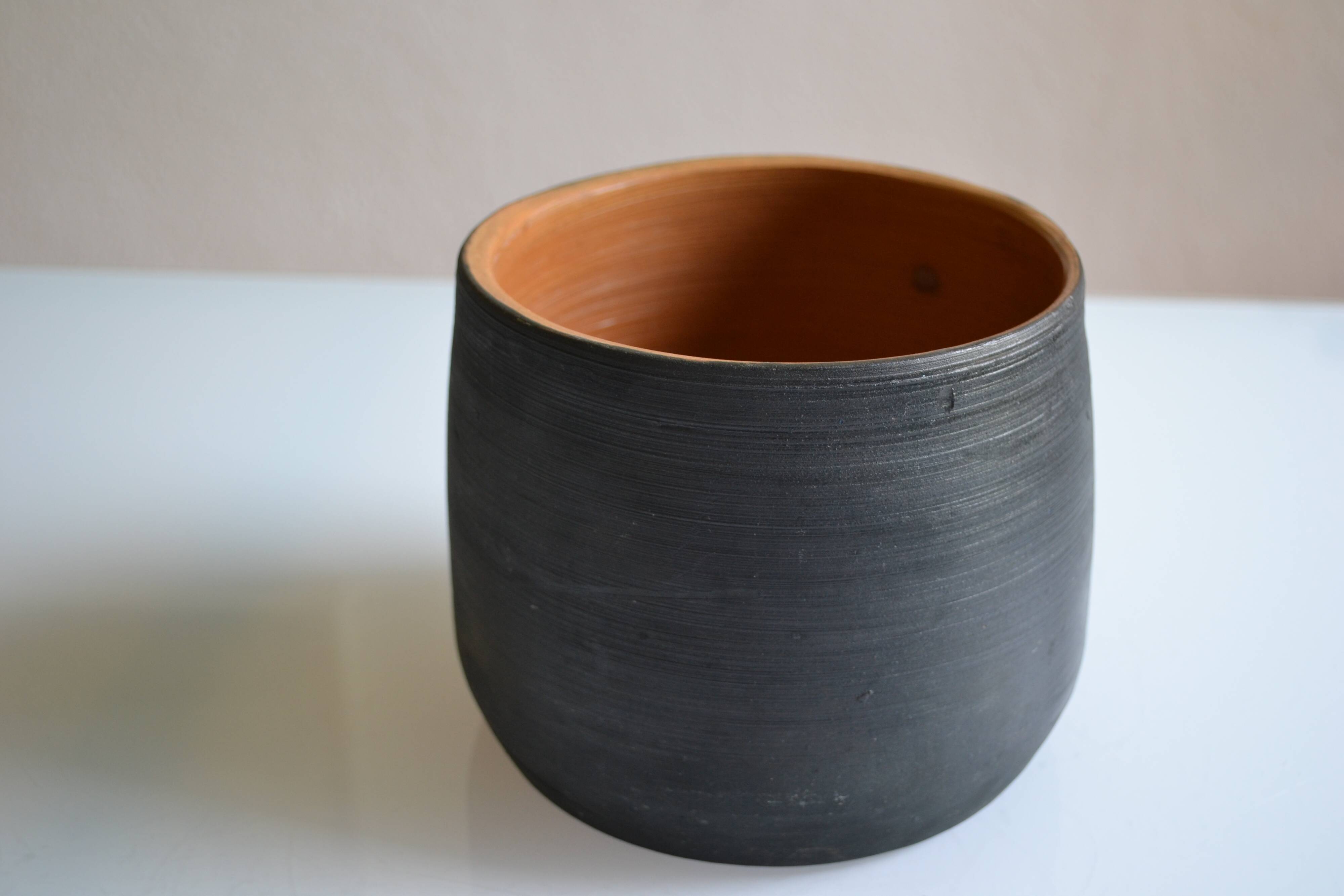 Ceramic cache pot or pocket emptying dish with a signature fish to identify.