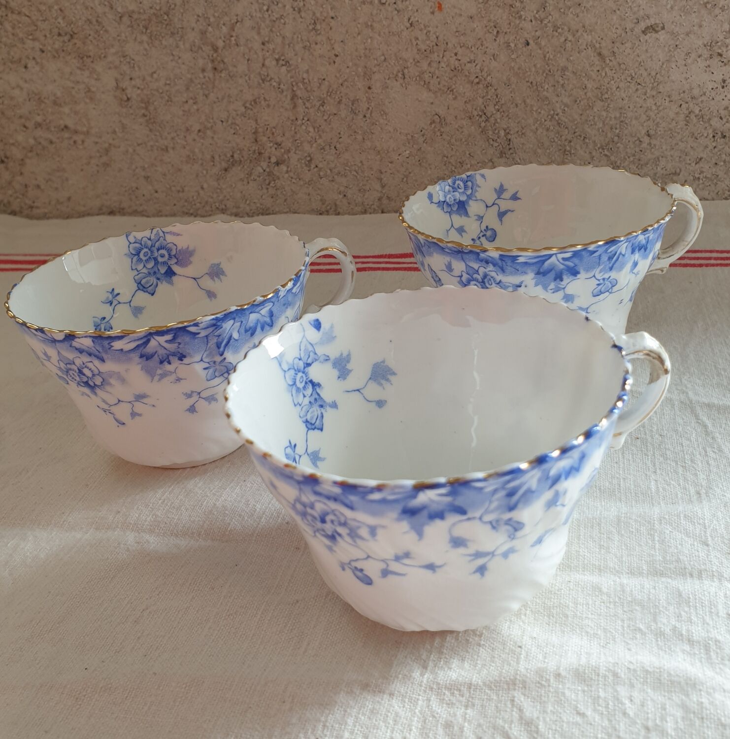 Trio of fine porcelain cups