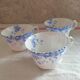 Trio of fine porcelain cups