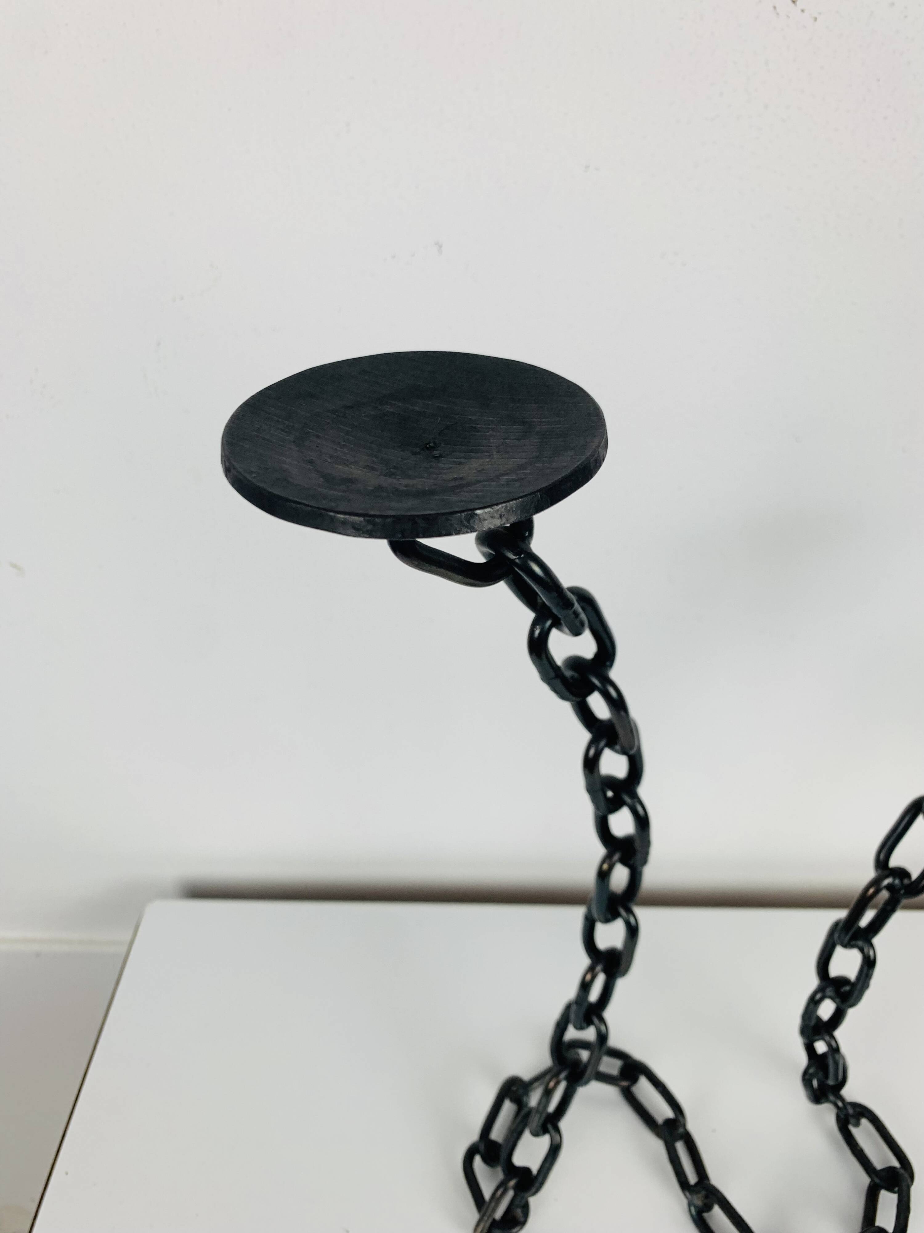 Brutalist and sculptural candle holder in wrought iron, chain links