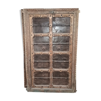 Old wooden door with frame