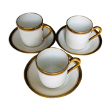 Set of three coffee cups and their sub-cups
