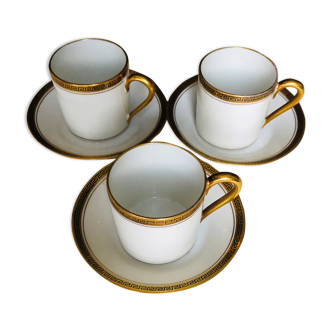 Set of three coffee cups and their sub-cups