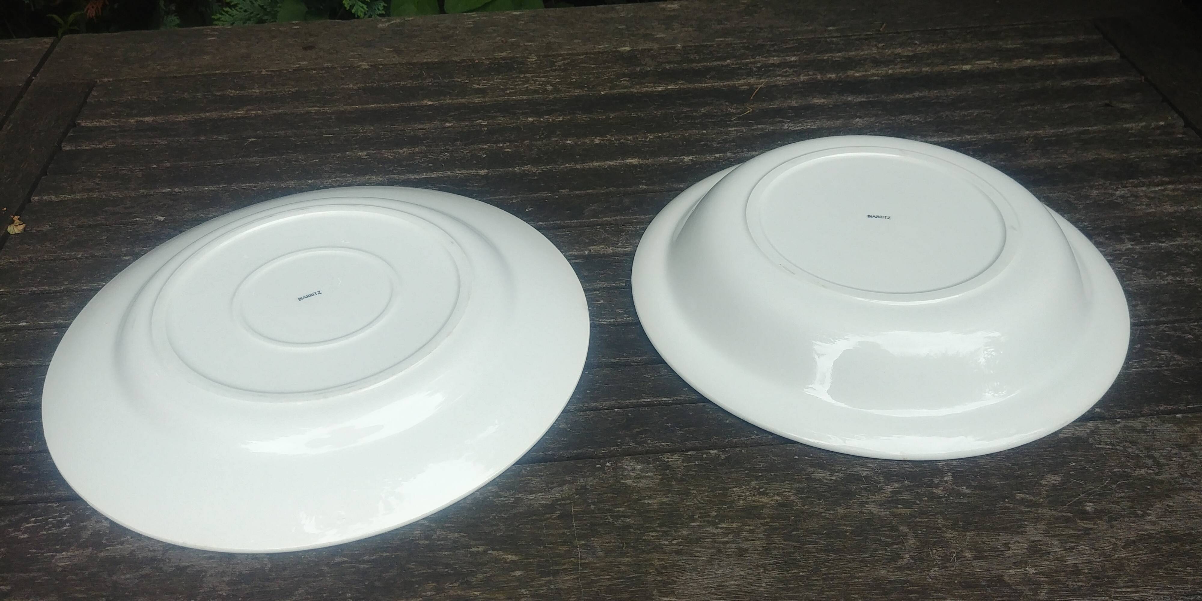 Lot of two large old porcelain serving dishes signed "Biarritz".
