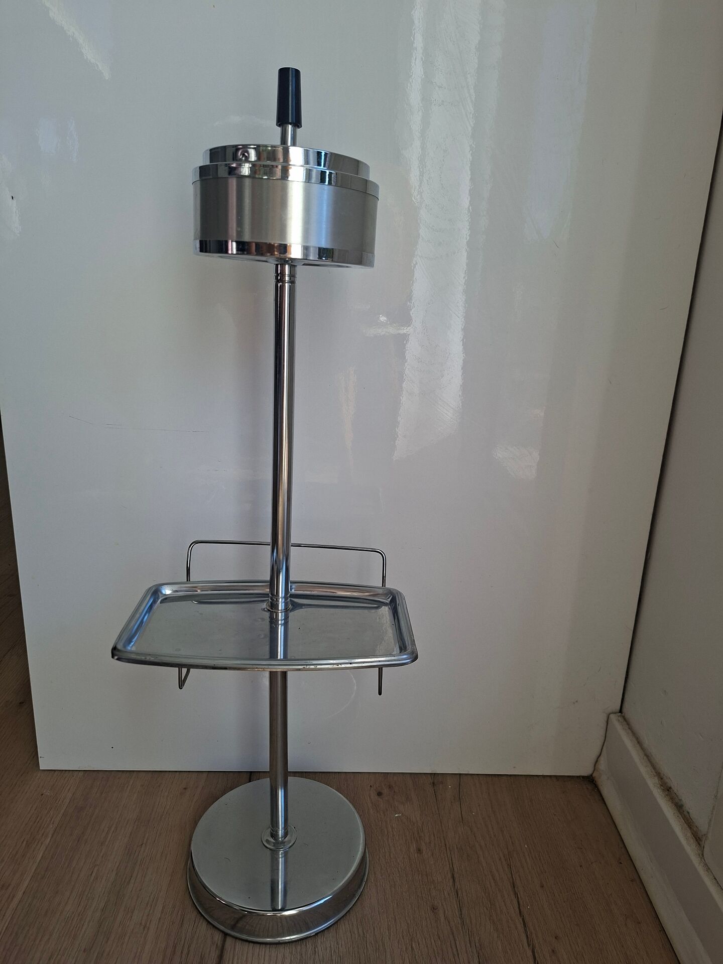 Vintage chrome metal floor ashtray with integrated tray.