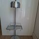 Vintage chrome metal floor ashtray with integrated tray.