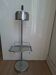 Vintage chrome metal floor ashtray with integrated tray.