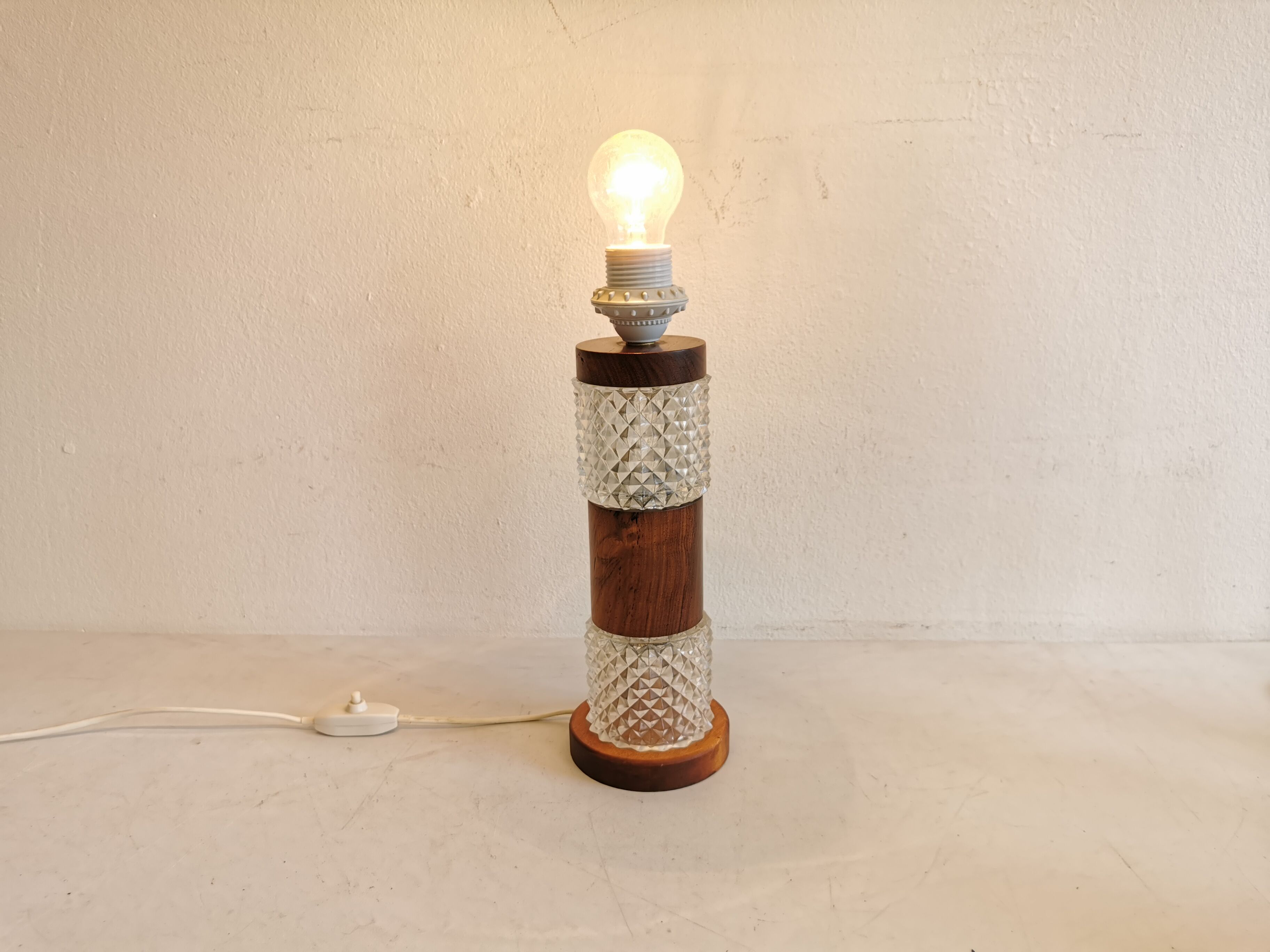 Swedish table lamp, made of what looks like rosewood and crystal glass.