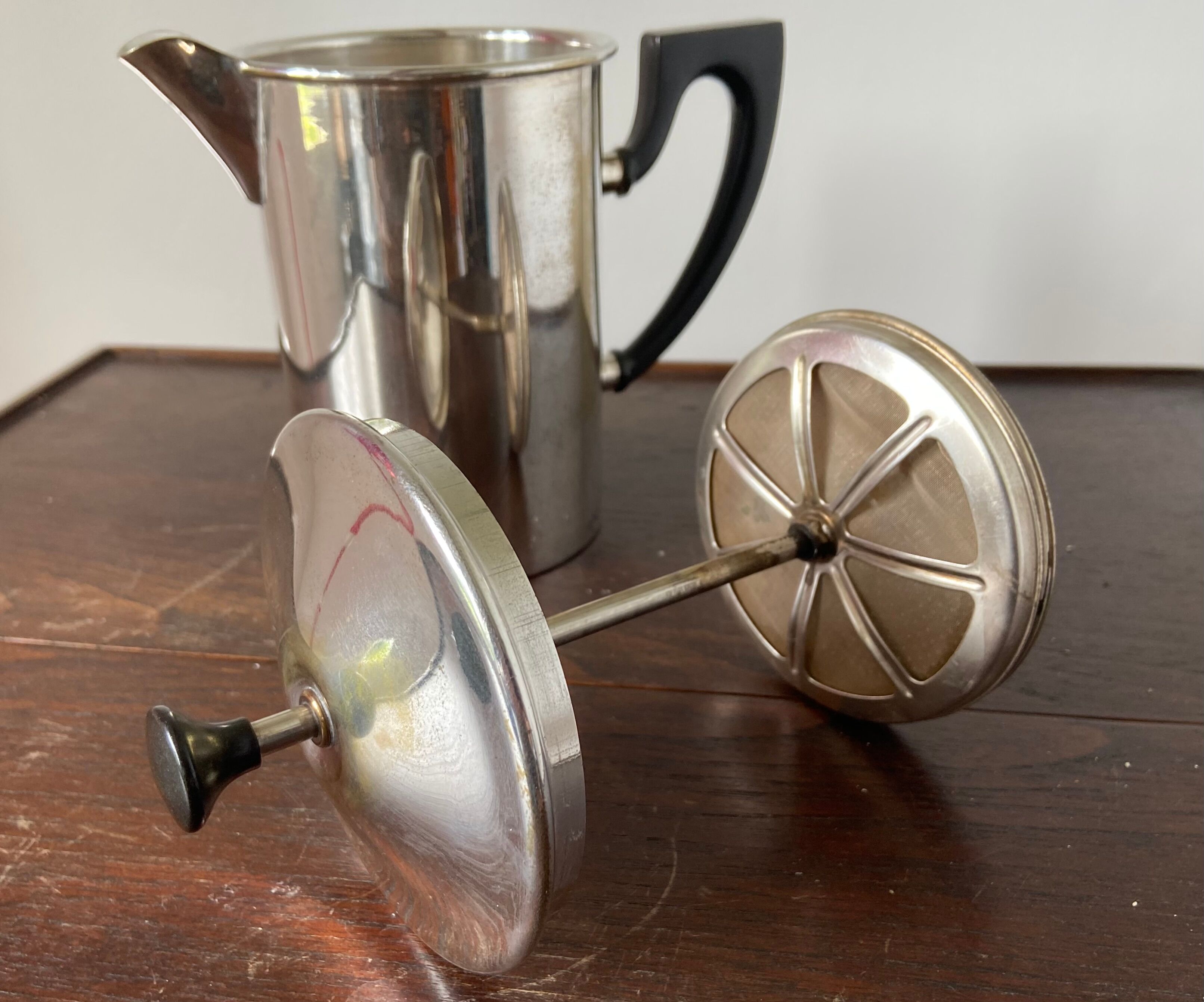 Old silver metal piston coffee maker