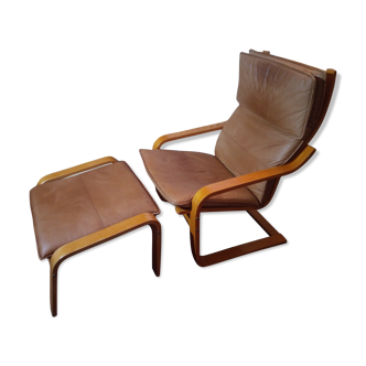 Armchair with leather footrest Poem by Norboru Nakamura