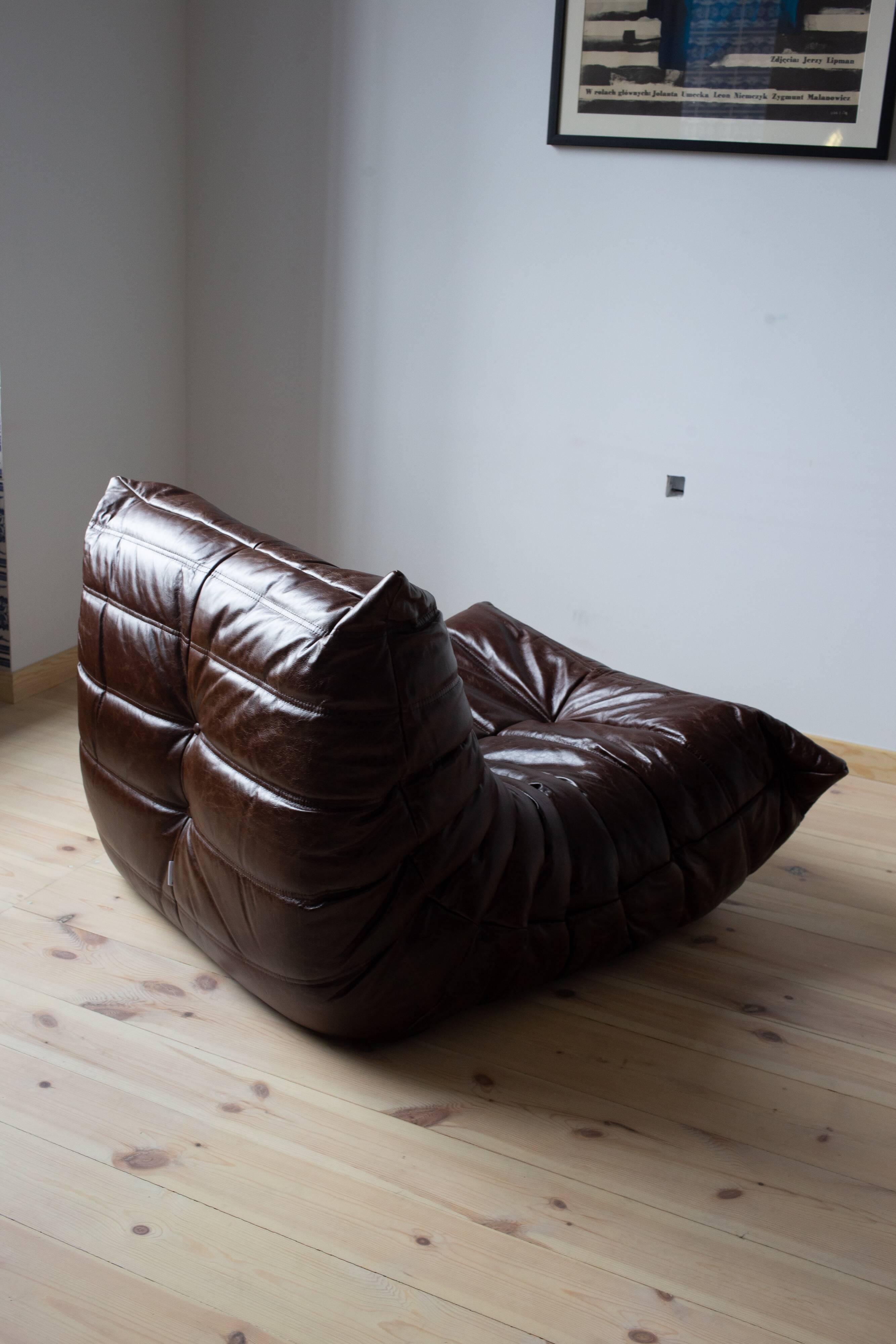 Togo armchair in dark brown shiny leather