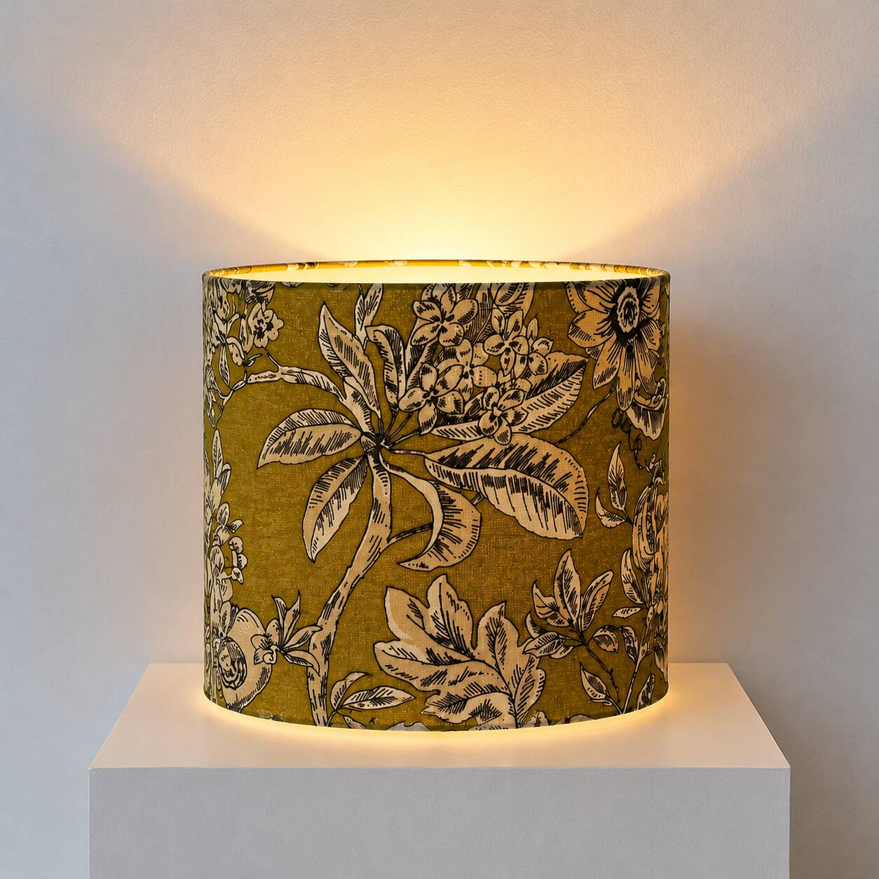 Lampshade dressed in a modern tropical-inspired pattern blending