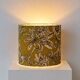 Lampshade dressed in a modern tropical-inspired pattern blending