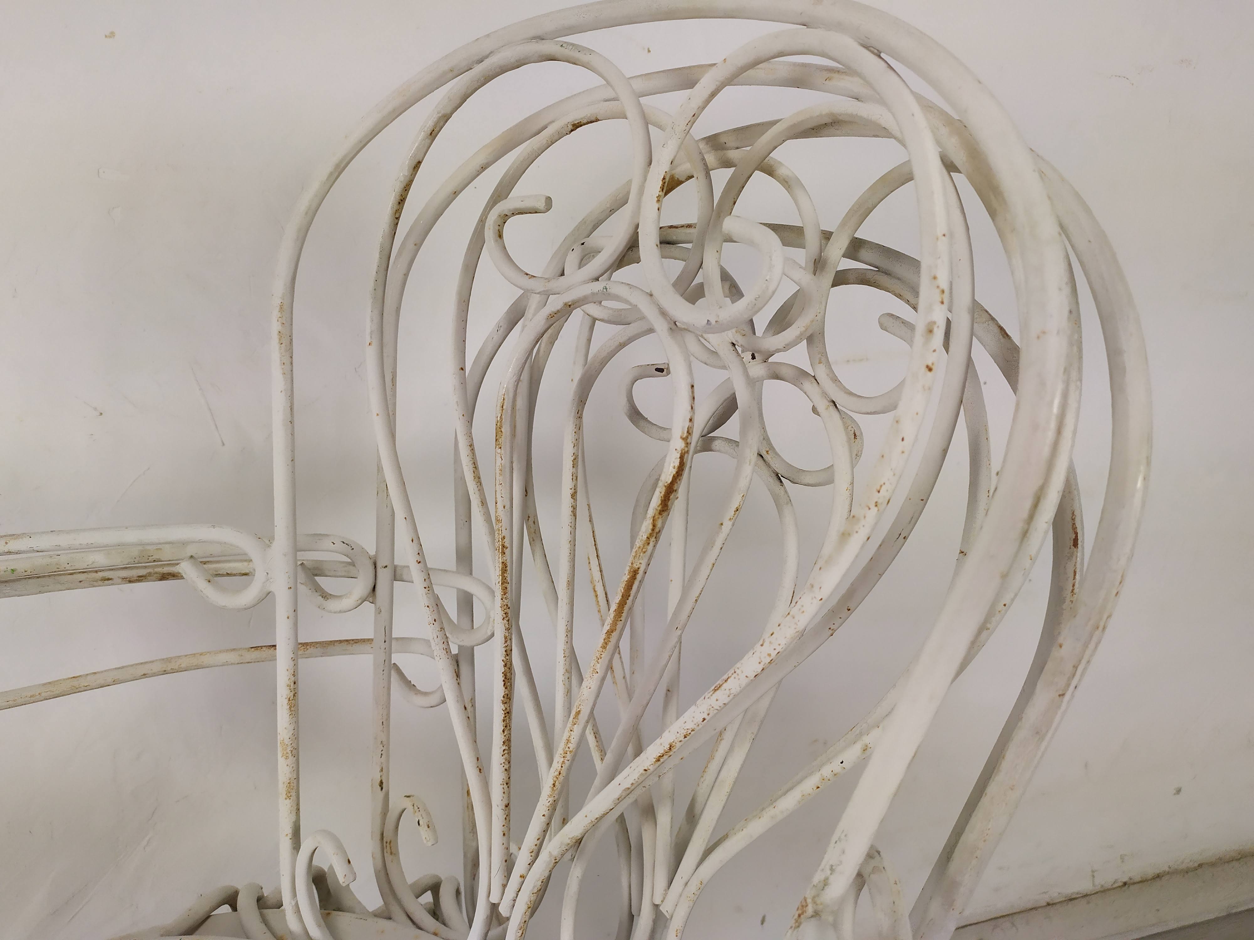 4 wrought iron garden armchairs