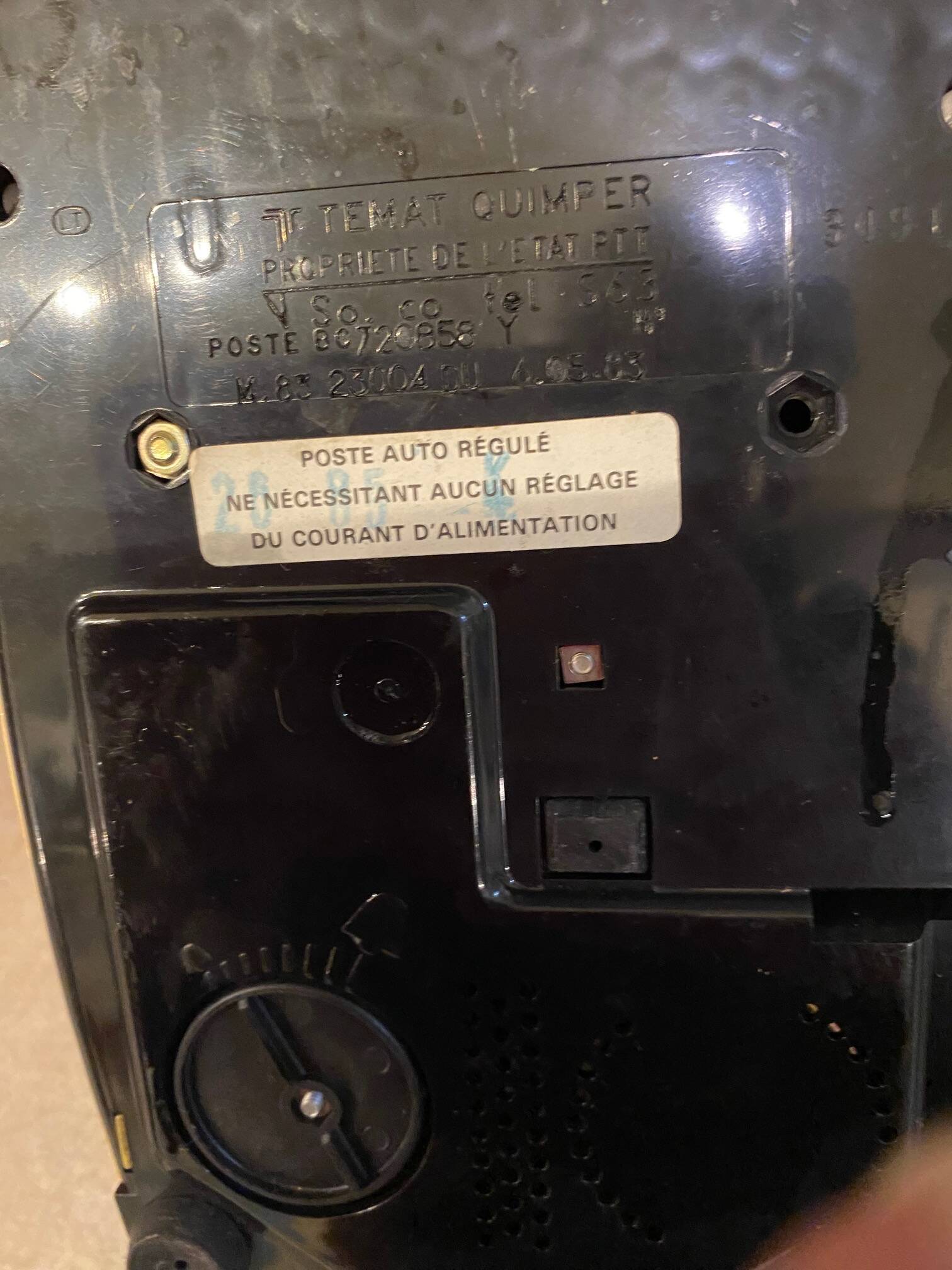 Old dial telephone from the 80s temat quimper bakelite yellow and beige