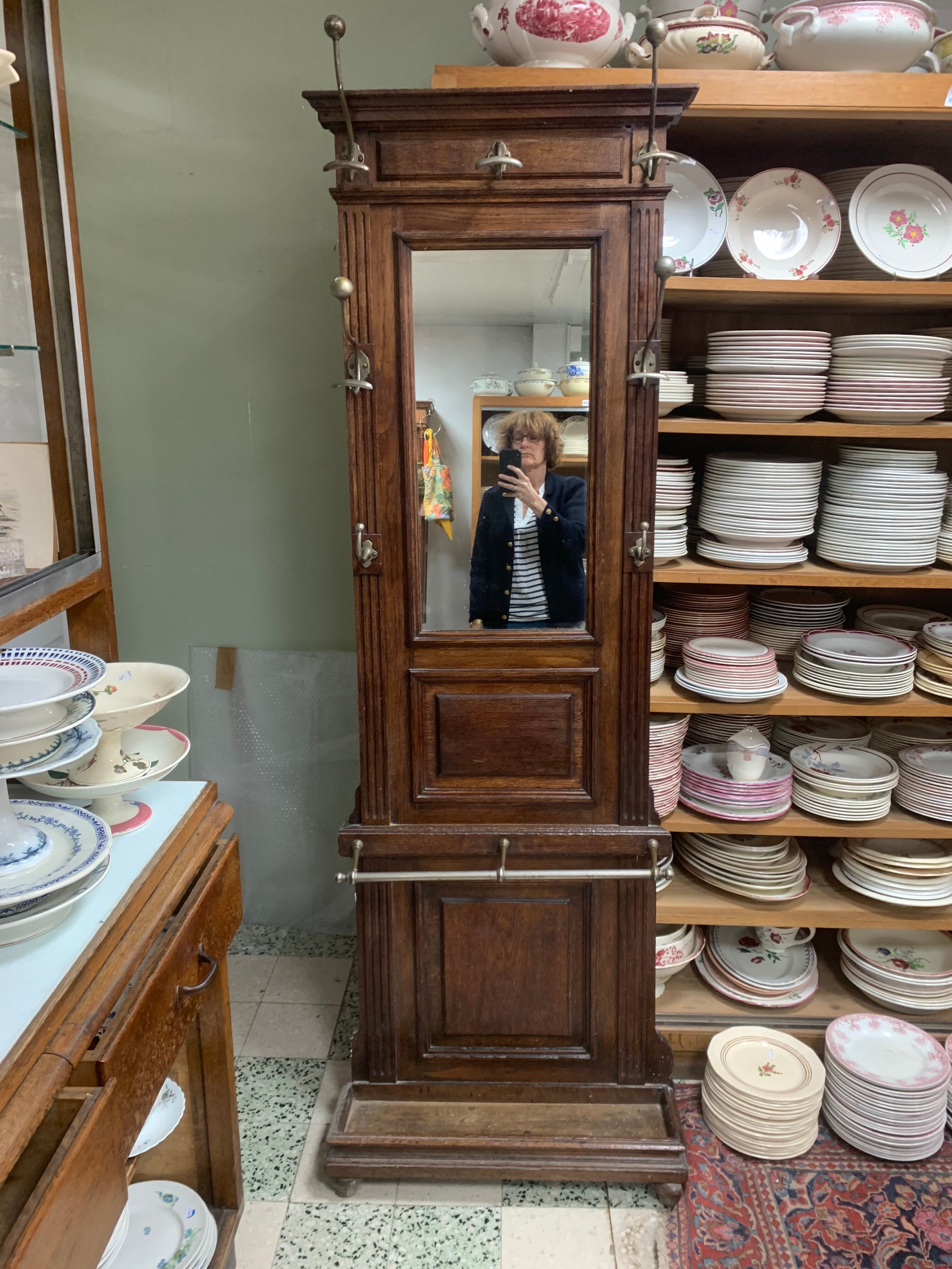 Old wall-mounted mantle-holder cloakroom in see