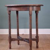 Candle holder side table with spool legs
