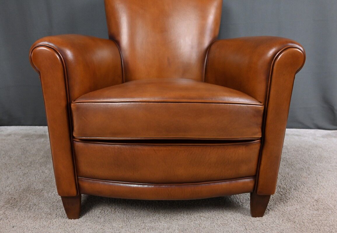 Paire de fauteuils club en cuir