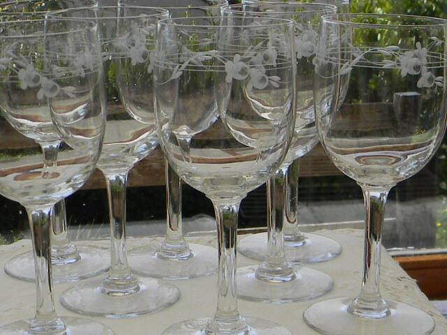 Set of 8 antique glass water glasses. Engraved floral border