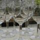 Set of 8 antique glass water glasses. Engraved floral border