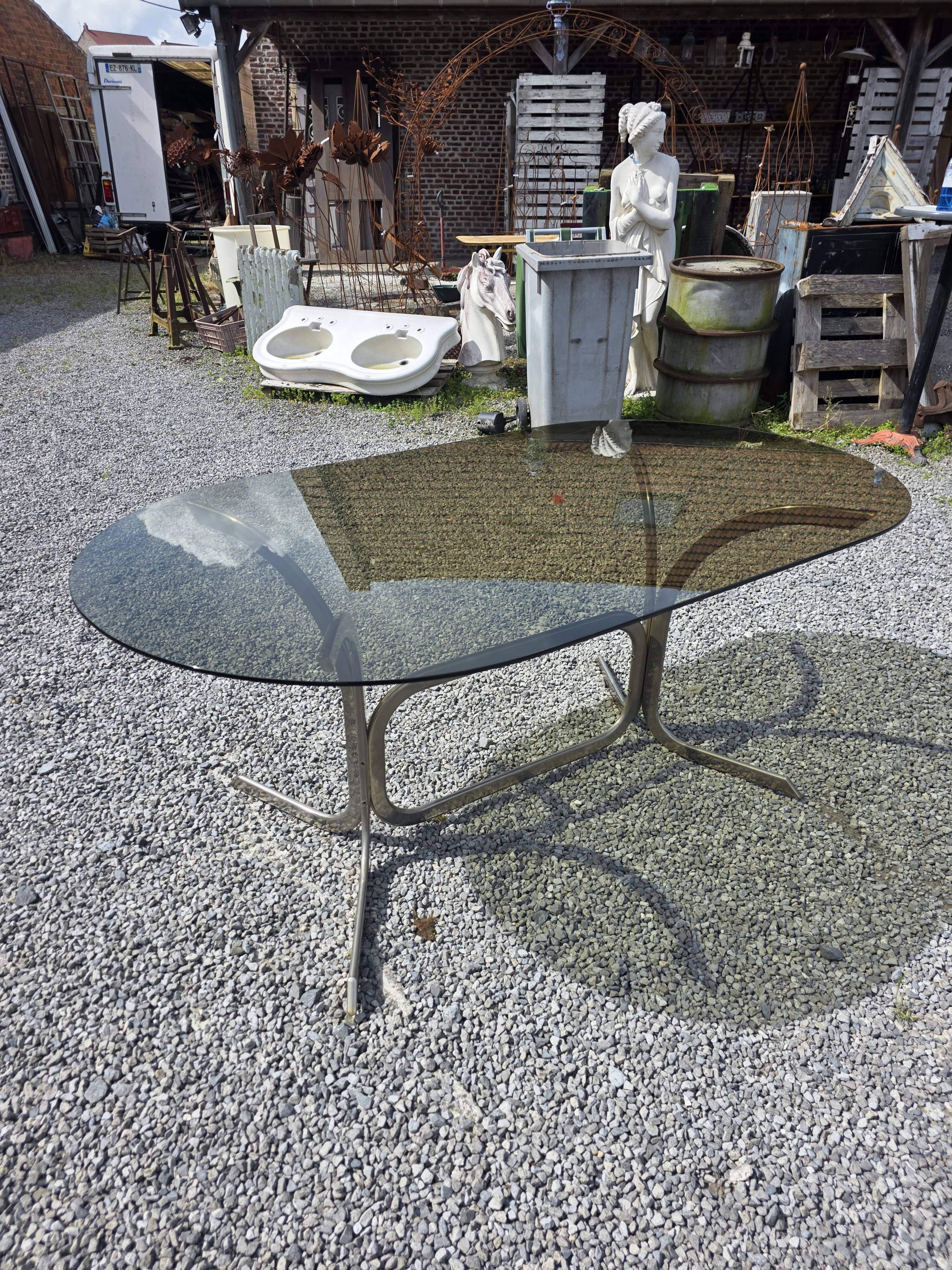 Silver metal table with smoked glass top from the 1970s.