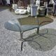 Silver metal table with smoked glass top from the 1970s.