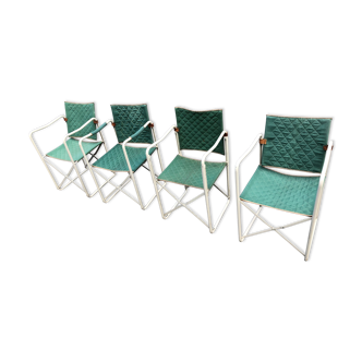 Four armchairs by Jacques Hitier