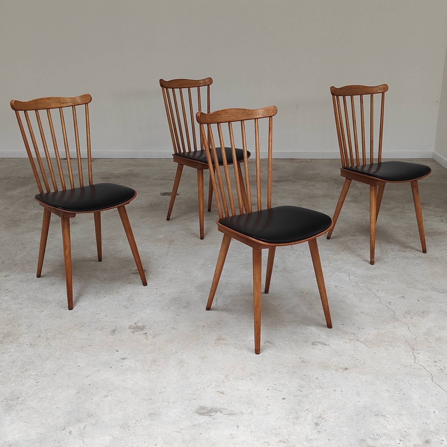Set of 4 Baumann Menuet chairs black leatherette compass legs