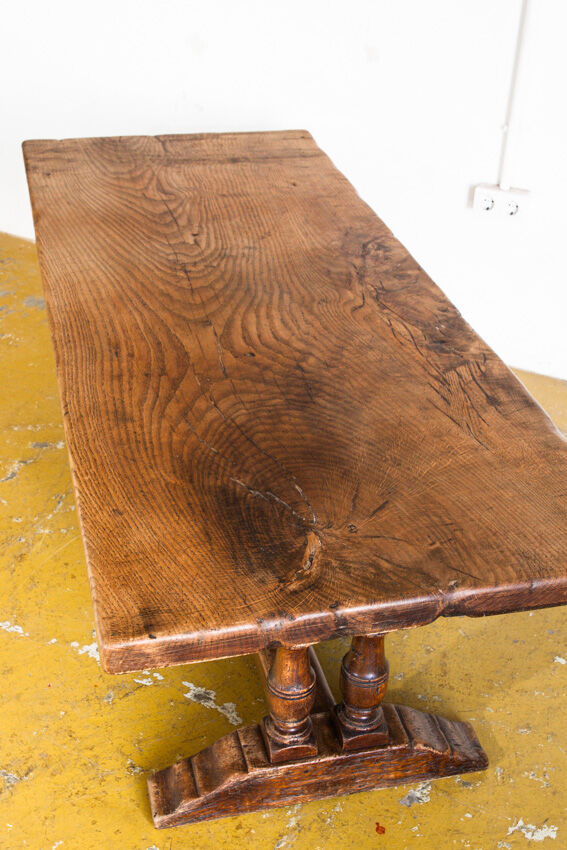 Old coffee table in solid oak wood. France, early twentieth century.