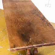 Old coffee table in solid oak wood. France, early twentieth century.