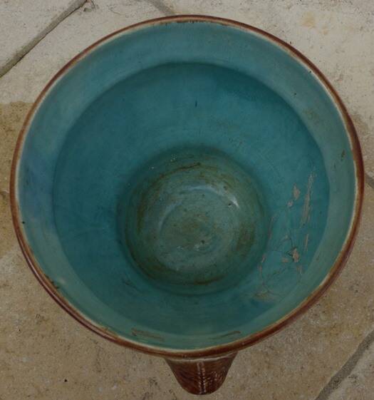 Old earthenware cachepot with woman decoration