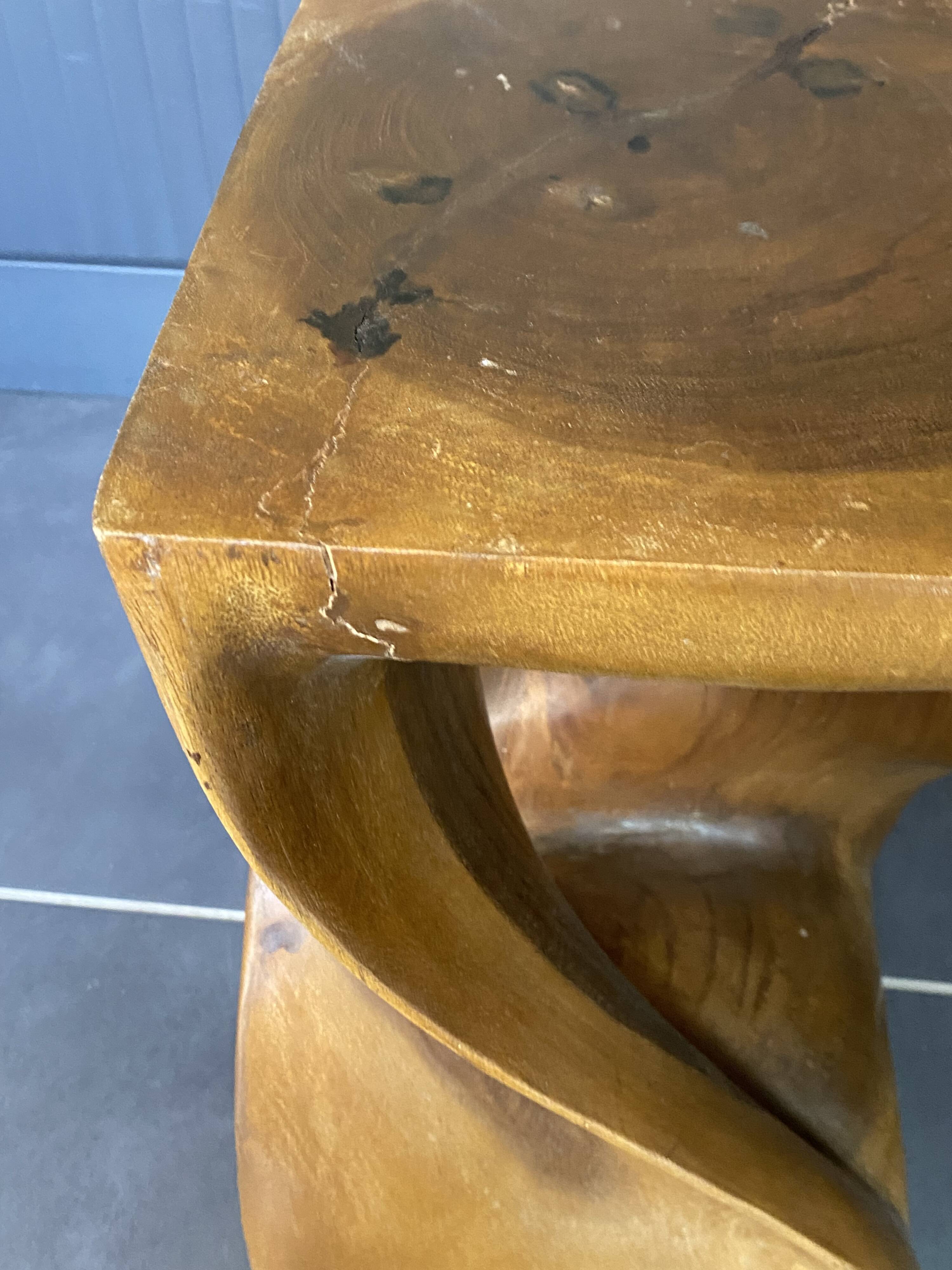 Stool n2 in solid raw walnut wood carved from the mass 1970