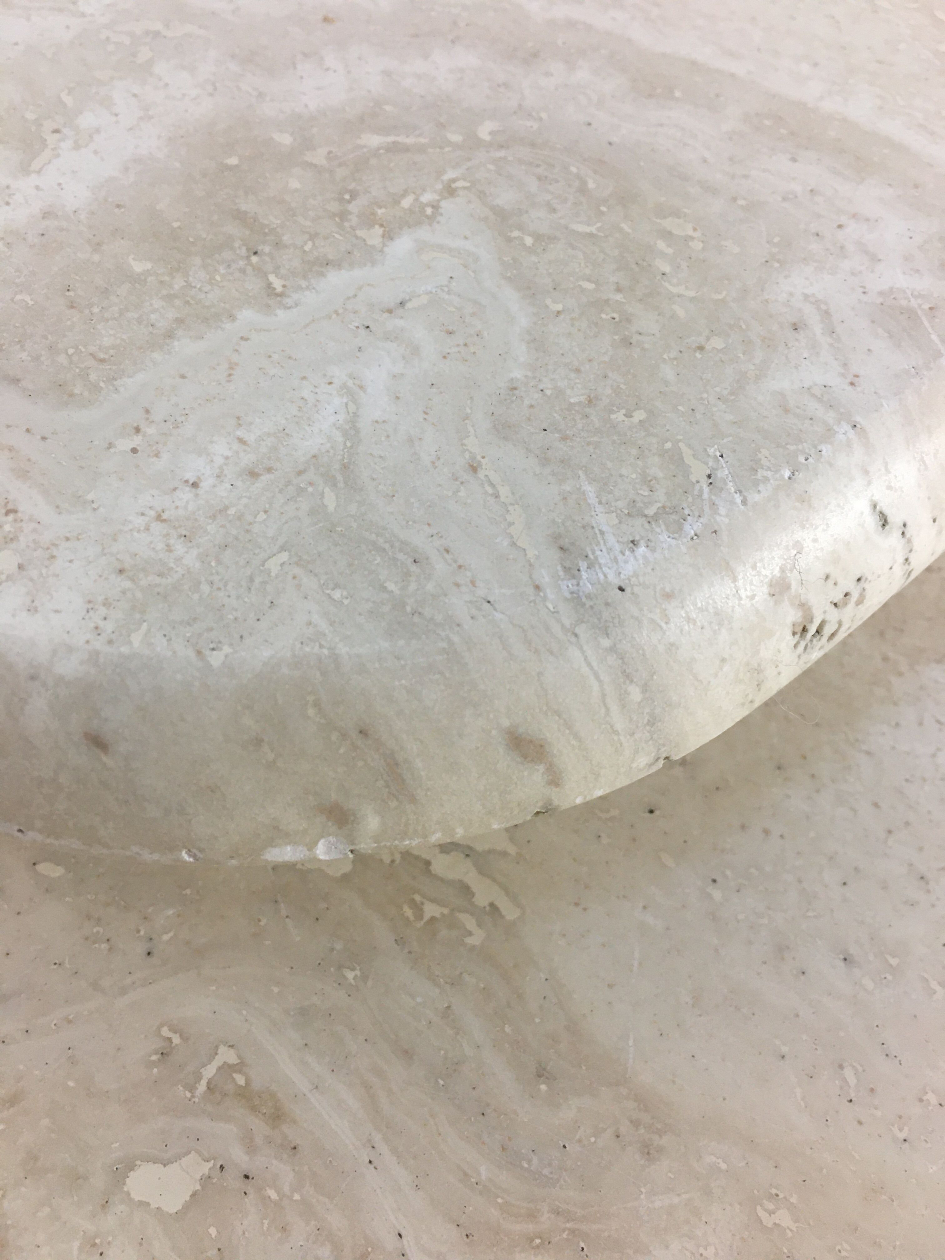 Three travertine trundle coffee tables