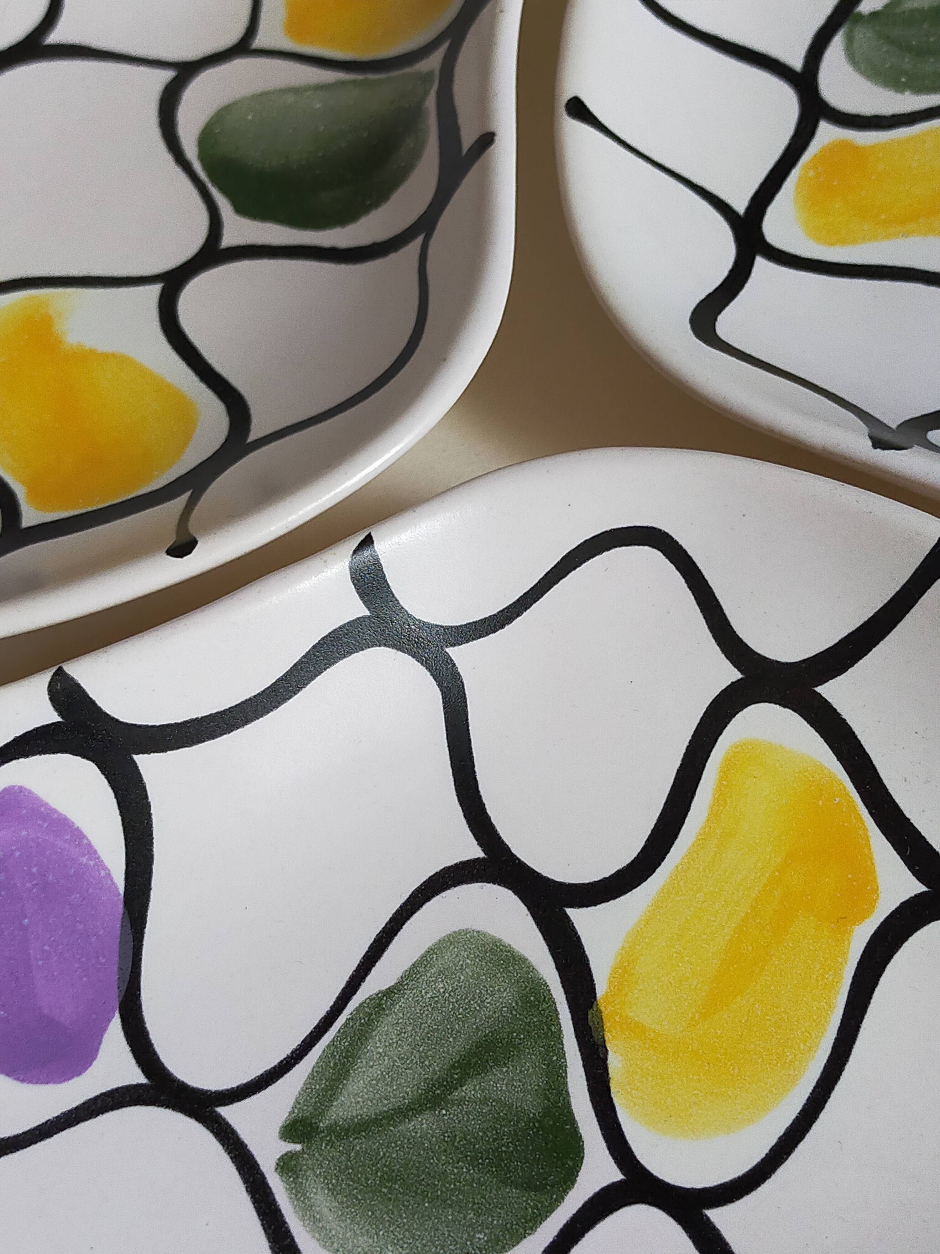 Three vintage free-form ceramic ravine dishes from the 1950s