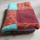 Plaid en patchwork tricoté main