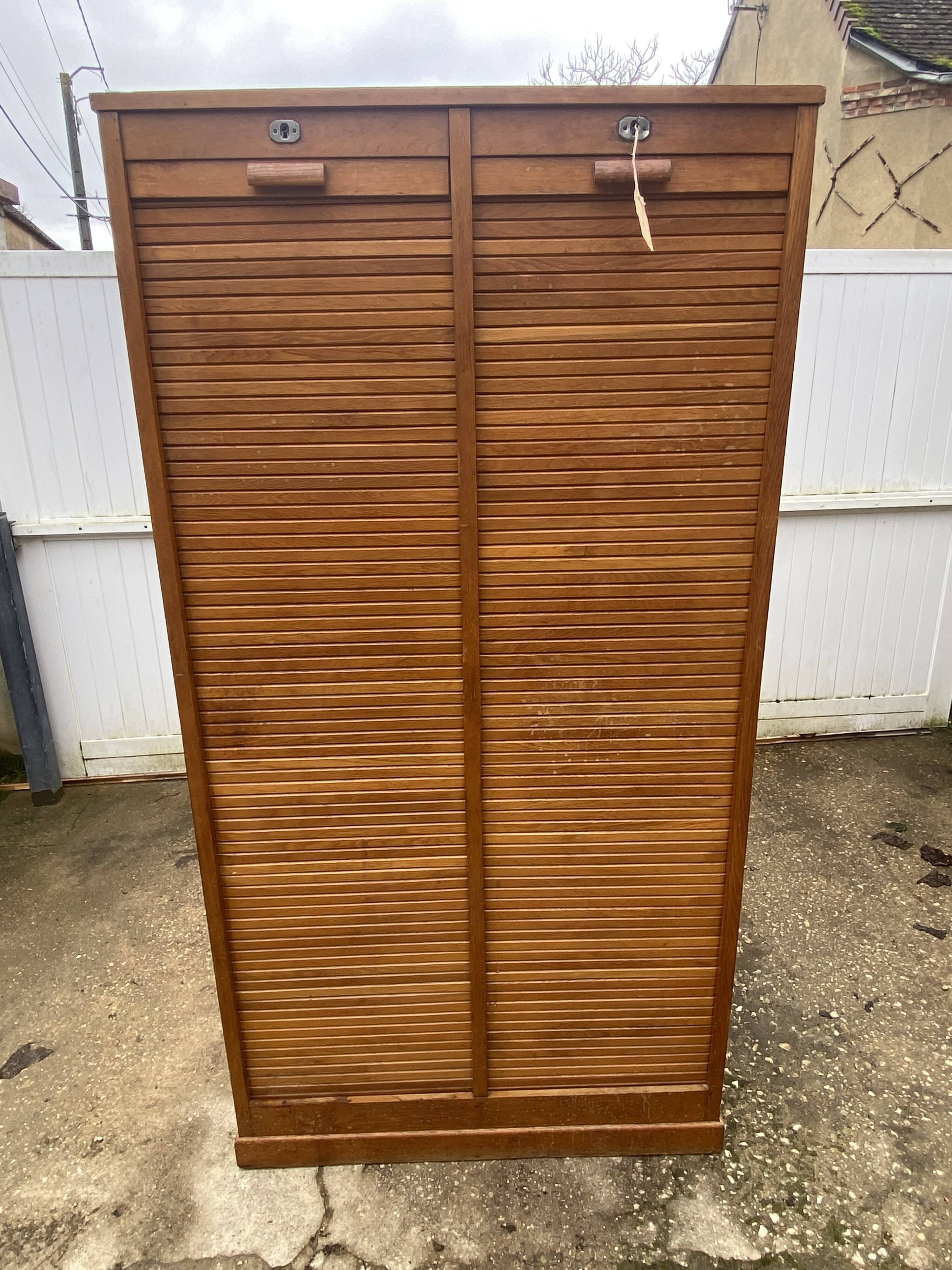 Double-column oak filing cabinet with curtains, 1950s.